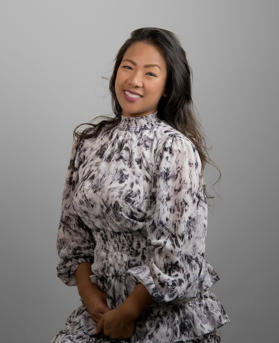 Portrait of Dr. Ann-Catherine Bautista in a floral dress